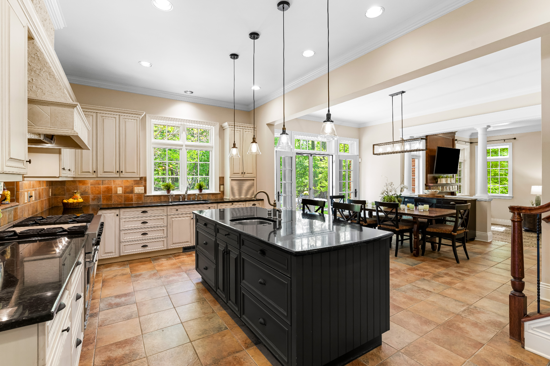 Current kitchen with warm wood cabinetry and granite counters