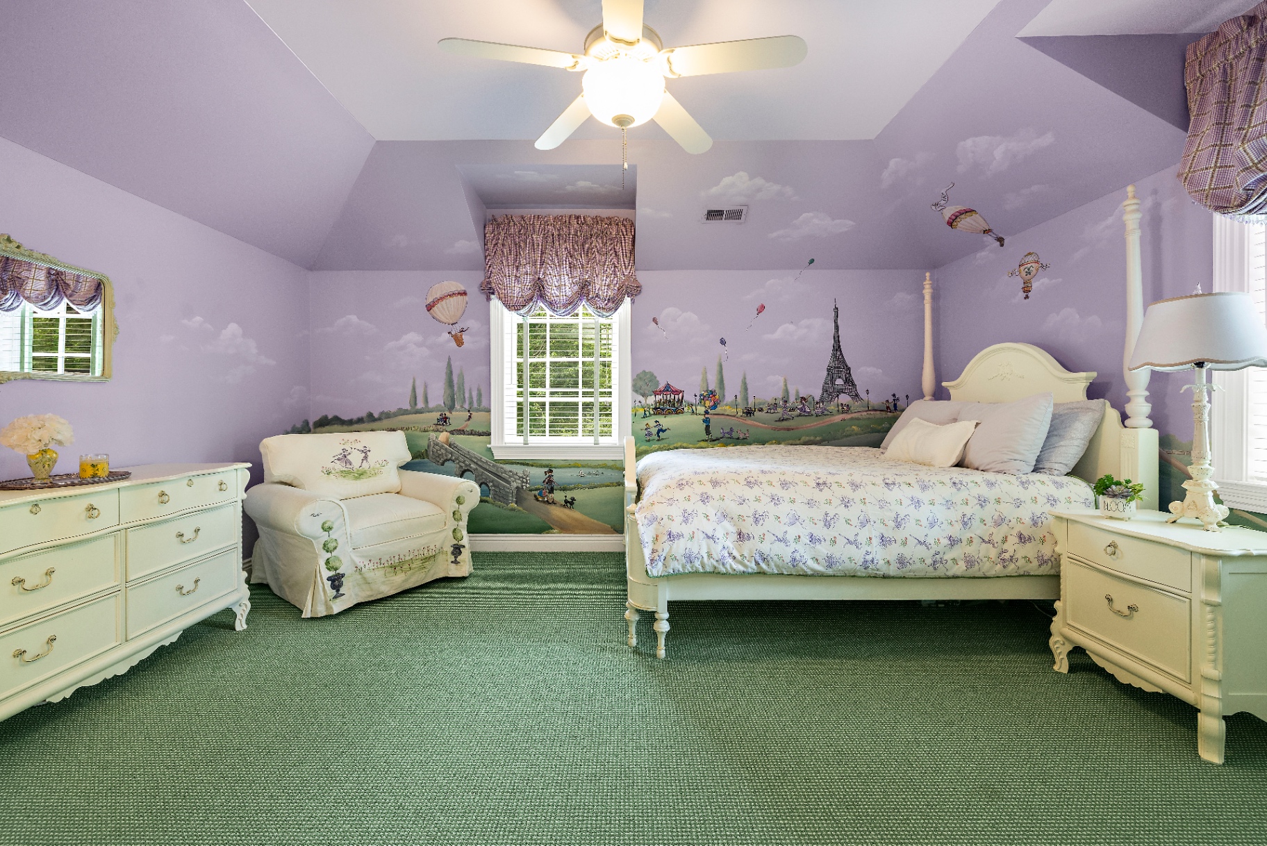 Children's bedroom with hand-painted French countryside mural, Eiffel Tower, hot air balloons, and vaulted ceiling